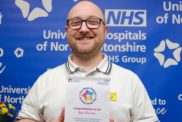 Adam Blunt with his award.