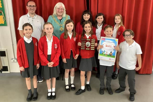 Stanion Primary School lift the trophy/Stanion Primary School