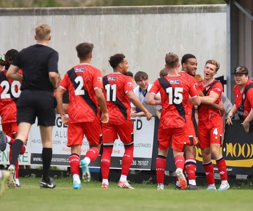 Kettering's players celebrate the only goal of the game against Sporting Khalsa (Picture: Peter Short)