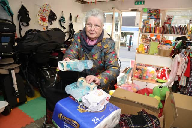Dorothy Hunt hands over donations paid for with her pension