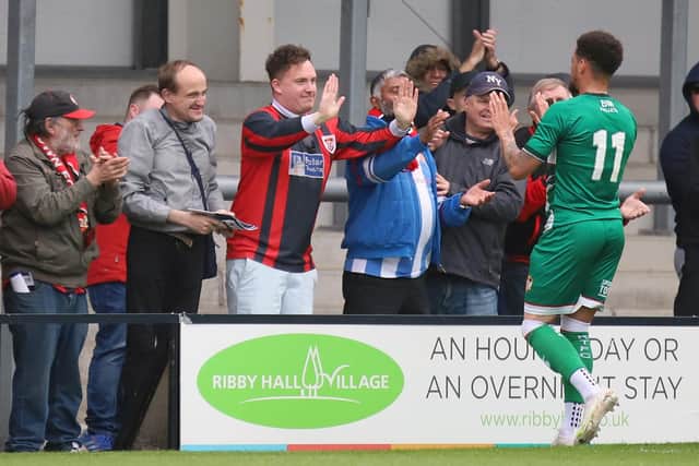 Rhys Sharpe thanks some of the travelling Kettering fans after the final whistle