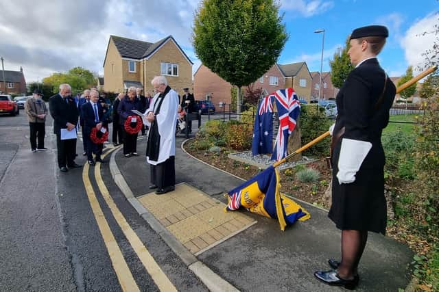People gathered to pay their respects a the memorial in Desborough