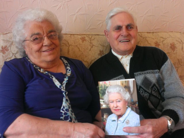Mary and Keith Whitman, from Windmill Avenue in Kettering, with their telegram from the Queen on their diamond wedding anniversary