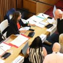 Cllr Jim Hakewill, head in his hand, after a pause in proceedings of the North Northants Council meeting to discuss the future of  Kettering Leisure Village as leaders meet with Adele Wylie (executive director of customer and governance)