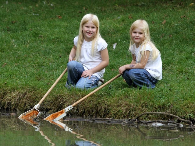 Sisters Emily, aged four, and Chloe Maddox-Hardy, aged six, pictured pond dipping during the fun afternoon at Rectory Farm Pocket Park, pictured in 2011