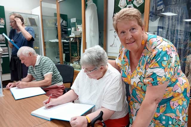 Sue Purcell & Ron Hanson signing books at Book Launch 16 Aug