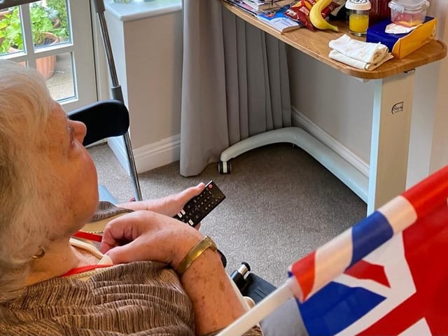 Resident watching the VE Day Celebrations on TV