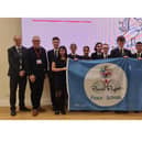 Students and staff with the Peace Project Blue Flag