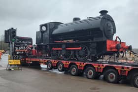 Northampton & Lamport Railway's latest arrival, a Hunslet Austerity steam loco, headed to its new home by road around Northampton