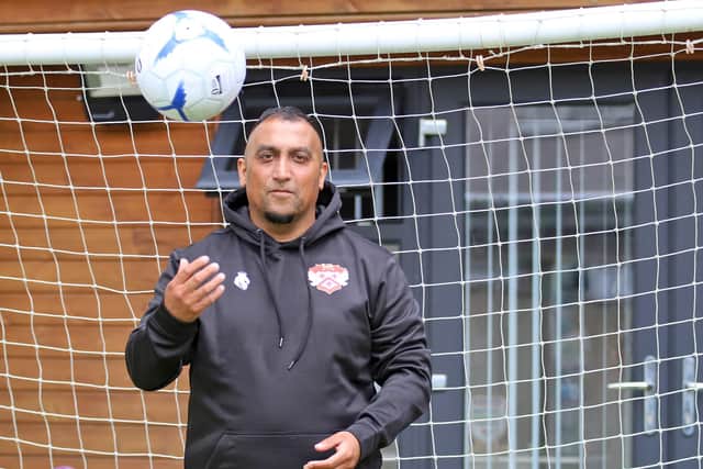 Having a ball... new Kettering Town owner Nadim 'George' Akhtar is excited by the challenges that lay ahead at Latimer Park (Picture: Peter Short)