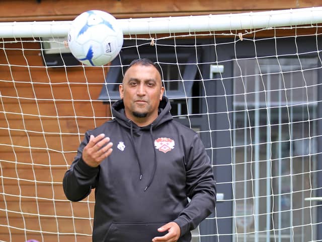 Having a ball... new Kettering Town owner Nadim 'George' Akhtar is excited by the challenges that lay ahead at Latimer Park (Picture: Peter Short)