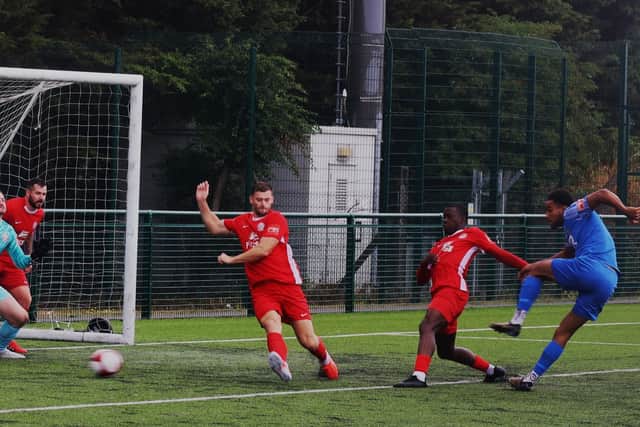 Tyrone Lewthwaite drills home Corby Town's goal in their 2-1 defeat at Quorn on Saturday (PIcture: David Tilley)