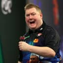 Ricky Evans celebrates a set win in his 3-0 first round victory over Simon Adams at the 2023/24 Paddy Power World Darts Championship at Alexandra Palace on Sunday (Picture: Tom Dulat/Getty Images)