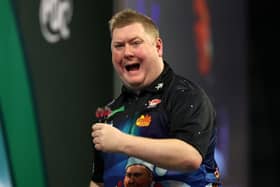 Ricky Evans celebrates a set win in his 3-0 first round victory over Simon Adams at the 2023/24 Paddy Power World Darts Championship at Alexandra Palace on Sunday (Picture: Tom Dulat/Getty Images)