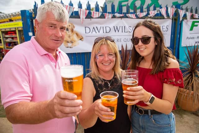 A family enjoying a beer at the Thrapston Beer Festival