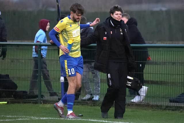 Will Jones hobbles off before half-time of the New Year's Day clash with St Neots (Picture: Phil Passingham)