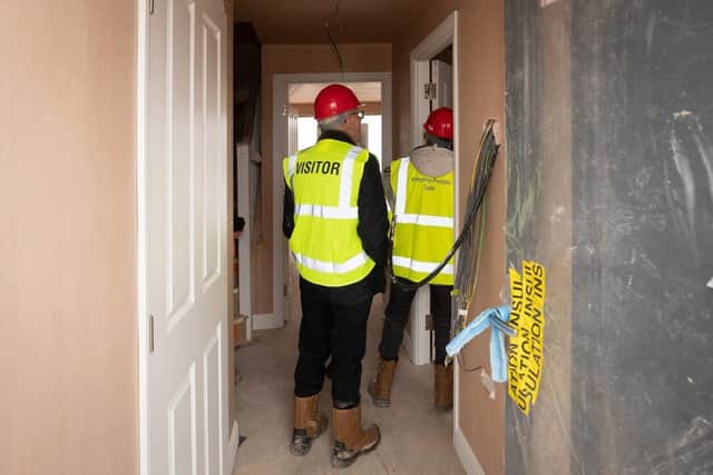 Visitors walking around a Barratt home at a Hard Hat event