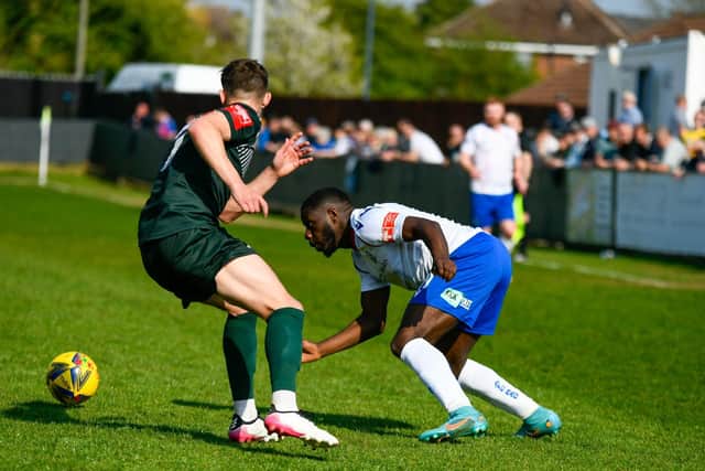 Nathan Tshikuna takes on a Bromsgrove opponent
