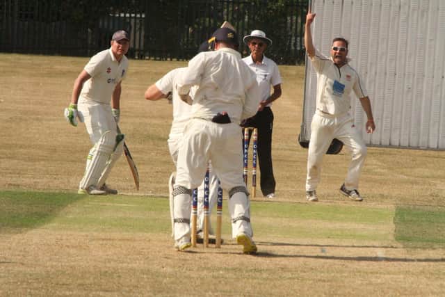 Old Northamptonians' Richard Kaufman celebrates one of his four wickets in the win over Geddington