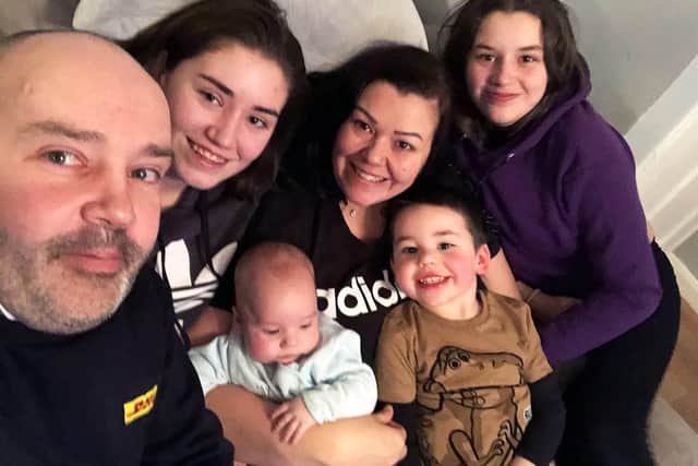 ,Shaun and Lindsey McAuley with their family