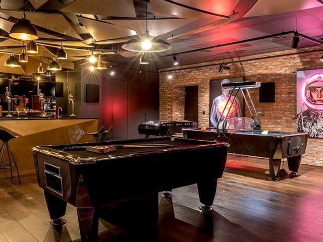 Modern art fills the space giving it a radical 80s vibe.