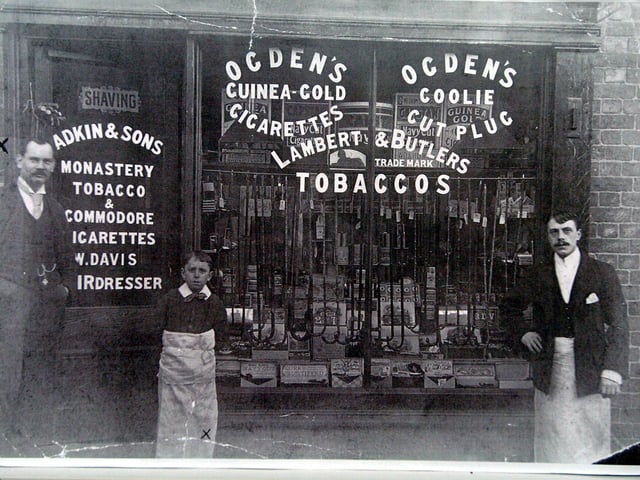 Adkins and Shaws Barbers and Tobacconists with William Davis on the left with his son Fred (middle)