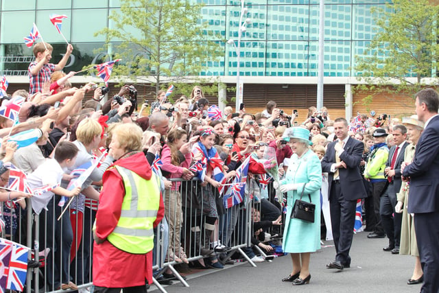Crowds greet Her Majesty Elizabeth Queen II outside Corby International Swimming Pool on Wednesday, June 13, 2012