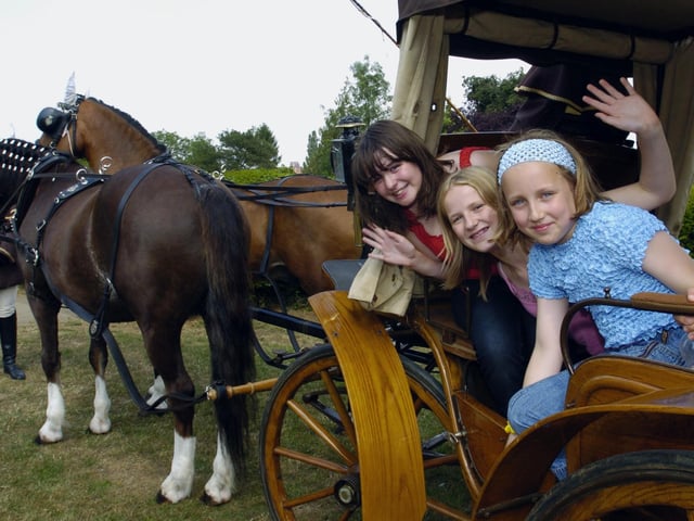 Harriet Desantis, Amber Cockridge and Tamsen Ziegler enjoy a horse and carriage ride. July 2006