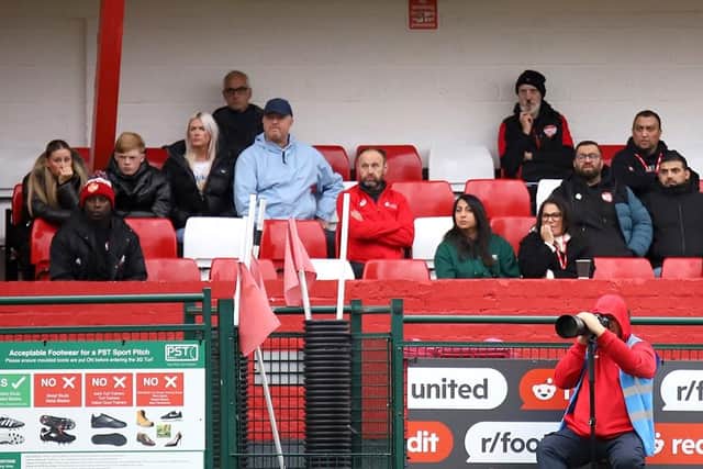 Director of football Fabian Forde (far left) and owner George Akhtar (far right) watch on as Kettering are hammered at Redditch (Picture: Peter Short)