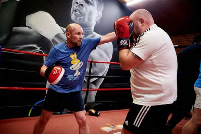 Craig McLundie (on the left) during training