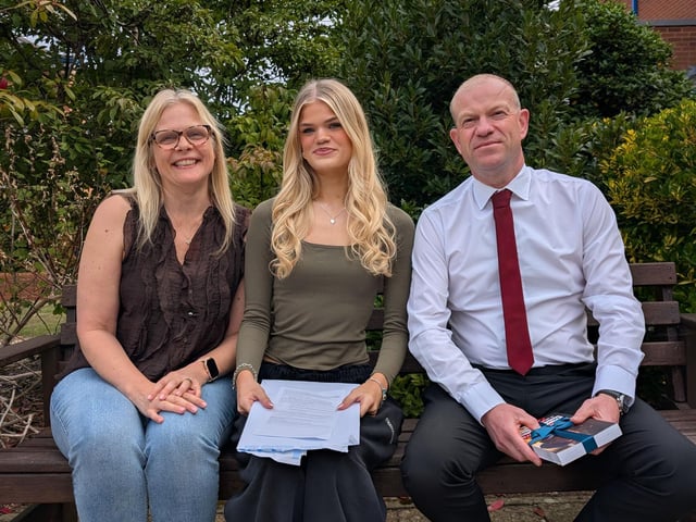 Holly, from Northampton High School, with her proud parents on GCSE results day