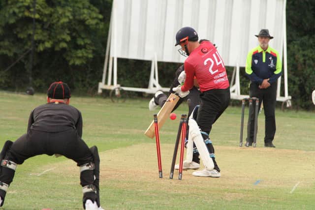 Brigstock's Tashwin Lukas bowls Kislingbury's Graham Cottle