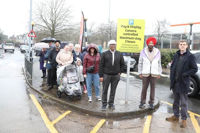 Rev Tom Houston (on right) with campaigners at the entrance to Sainsbury's car park in Rockingham Road Kettering /National World