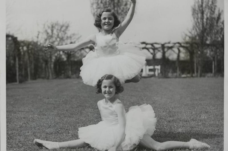 Nancy Munks, aged eight, who won the All-England Dancing Championship for 1934 out of 5,000 entrants, has a twin sister, Mollie, who won the championship last year at the age of seven. They live at Northampton. - The clever dancing twins - who are extremely alike - photographed at their Northampton home.