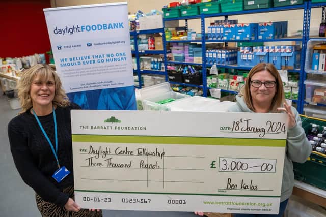Staff from the Daylight Centre Fellowship receiving their cheque.
