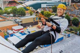 Rebecca absailing down the Leicester royal infirmary building 