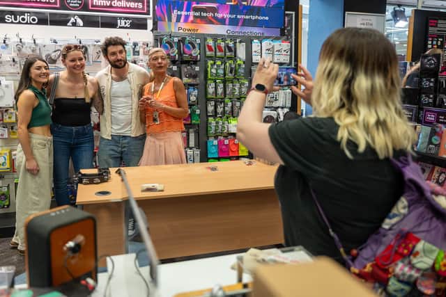 Billy Lockett, with his mum and backing singer meeting fans at HMV in Northampton on Saturday, May 23, 2026. Photo by David Jackson.