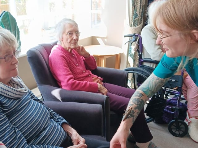 Charley show and discusses with residents the stick insects