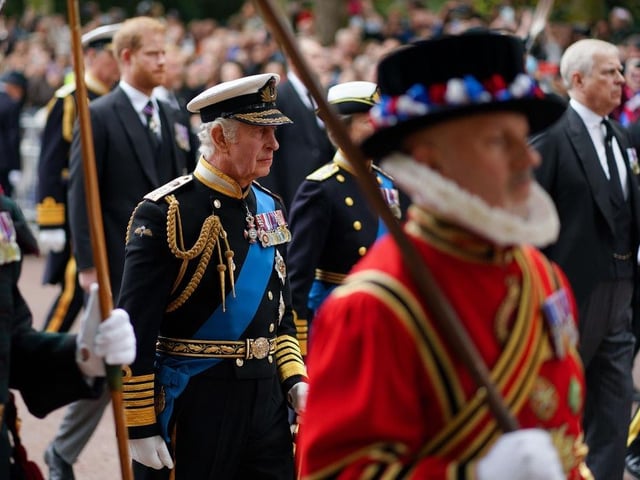 King Charles III follows behind The Queen's funeral cortege borne on the State Gun Carriage of the Royal Navy