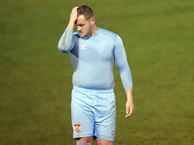 A disconsolate Dan Jezeph leaves the pitch after being red-carded (Picture: Peter Short)