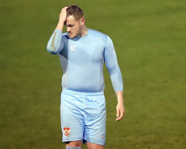 A disconsolate Dan Jezeph leaves the pitch after being red-carded (Picture: Peter Short)