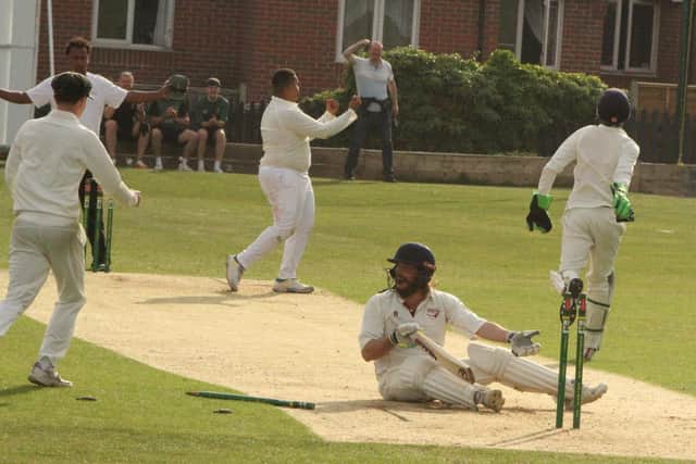 Saints celebrate the stumping (off a wide!) that won them the game against Brigstock in NCL Division Two (Picture: Finbarr Carroll)