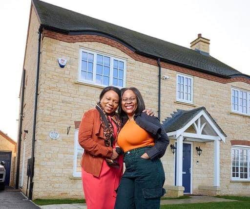 Lucy Mwape with her daughter Joyce Mwape, outside of her home