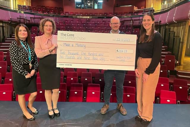 Hampton by Hilton Corby presents the cheque to The Core at Corby Cube