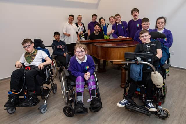 Billy Lockett visiting Greenfields Specialist School For Communication to donate the piano he wrote his debut album on. Photo by David Jackson.