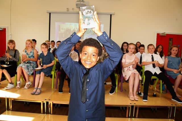 Reece Forsdike, who received a special glass trophy back in 2017 when he left Corby Old Village Primary after never missing a day through illness or absence