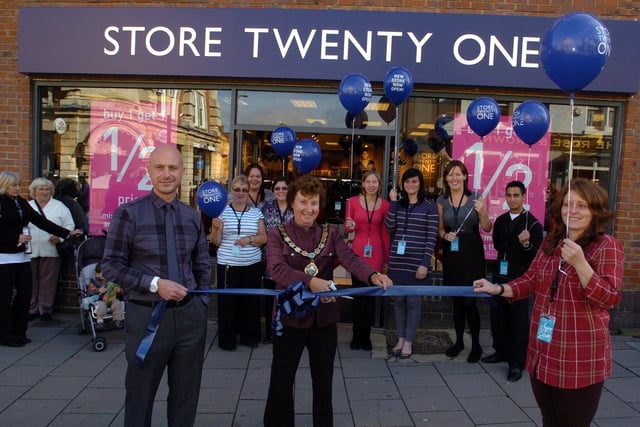 Rushden, Store Twenty One, opening of new shop on the High St. l-r Carlo Imbornone (regional manager) Mayor of Rushden Carol Childs, and Sarah Palmer (store manager) with staff members -  September 2010