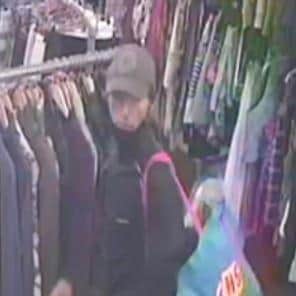 Detectives have identified a man spotted on CCTV cameras who may help track down a thief who stole from a Northampton charity shop