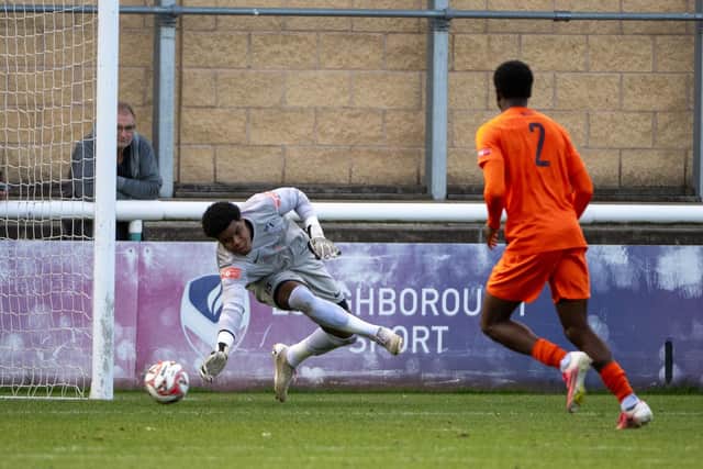 Corby Town goalkeeper Milai Perott makes a save in the 3-3 draw at Loughborough Students (Picture: Jim Darrah)