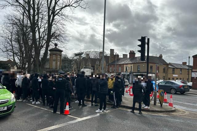 People gathered to pay their respects at the scene of the murder investigation in Kingsthorpe.